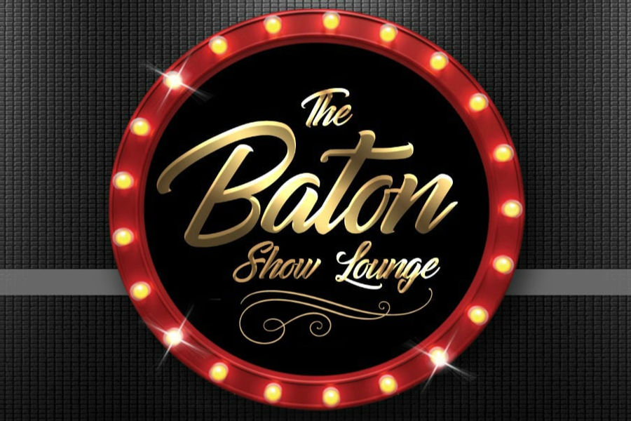 Logo of Baton Show Lounge with gold script inside a red round marquee lit with glowing bulbs.