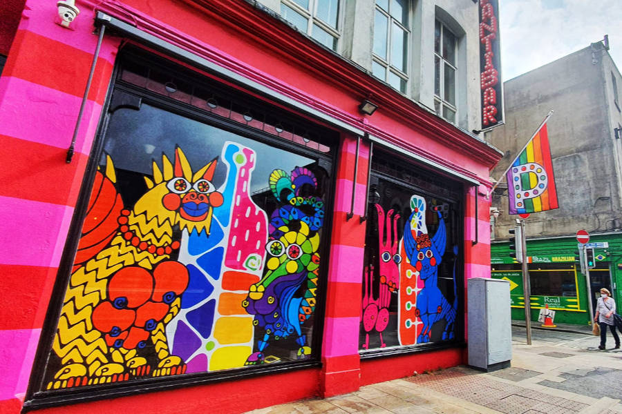 Colorful exterior of Pantibar in Dublin with rainbow murals and LGBTQ+ flag on display in January 2022.
