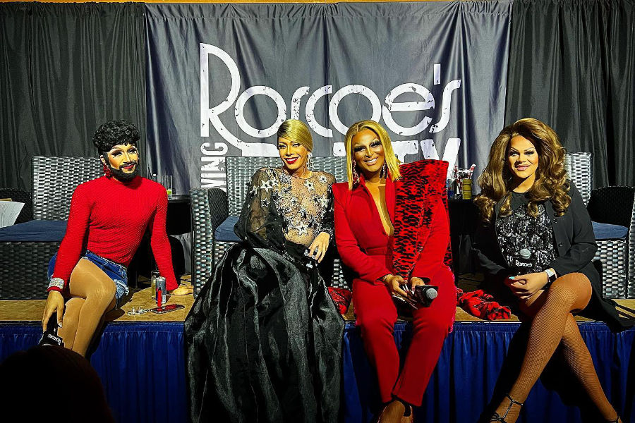 Four drag performers, including Roxxxy Andrews and Pangina Heals, onstage under Roscoe’s Tavern banner.