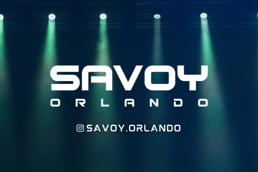 Savoy Orlando logo in white text, with stage spotlights shining above on a dark blue background.